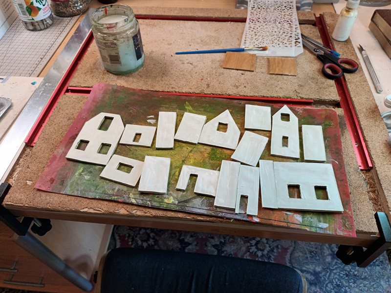 2.5mm walls made of two sheets of paper with wood slates in between